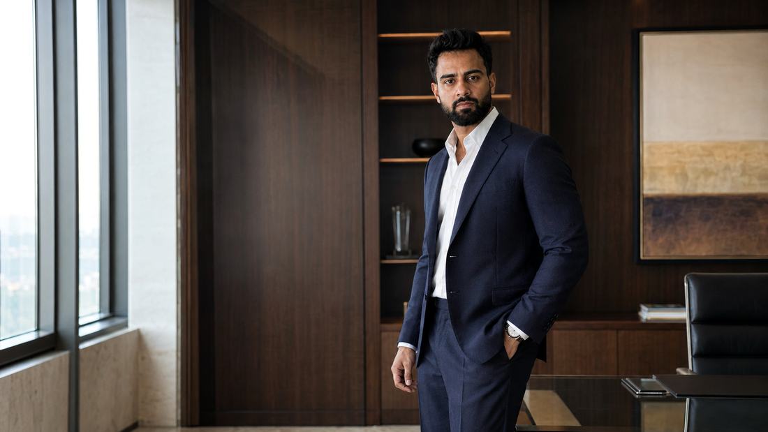 Syed Abdul of syed.ai, generative engine optimization and AI search consultant, in a corner office at dusk